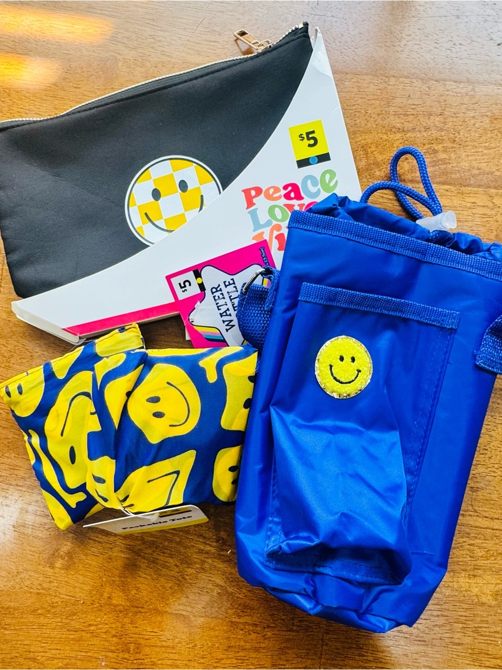 Collection includes Insulated Bottle Carrier, 2 tote bags, and a zipper pouch